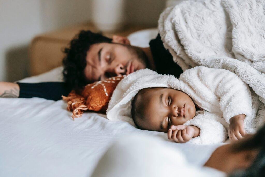 Dad and baby sleep cover image