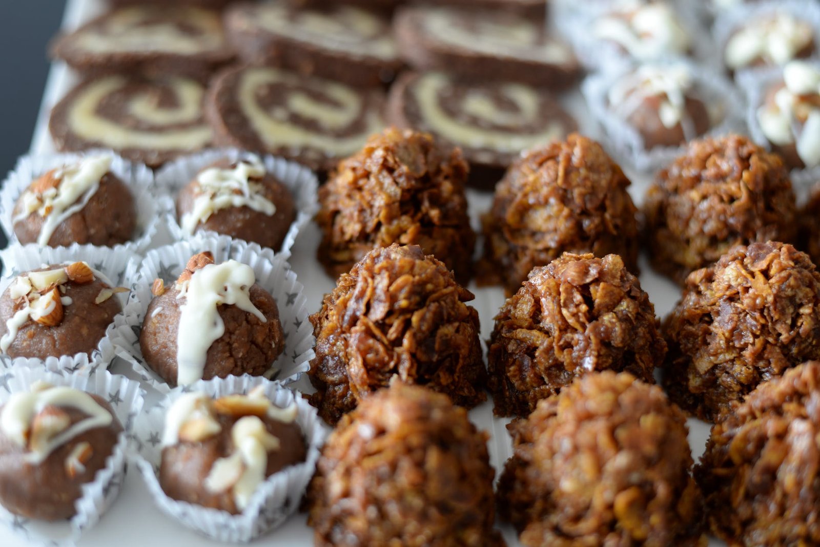 energy balls and cookies on white plate on table - Kid-Friendly Meals 